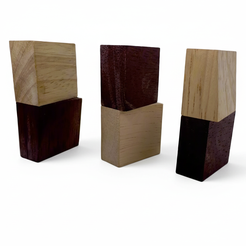 Three wooden blocks with different color combinations on a gray background