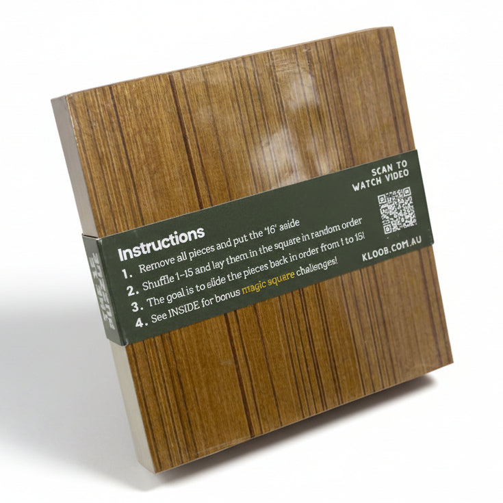 Wooden puzzle box with instructions and QR code on a gray background