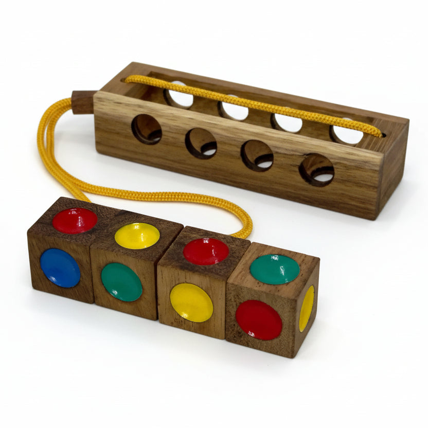 Wooden toy with colorful dots and a yellow string on a gray background